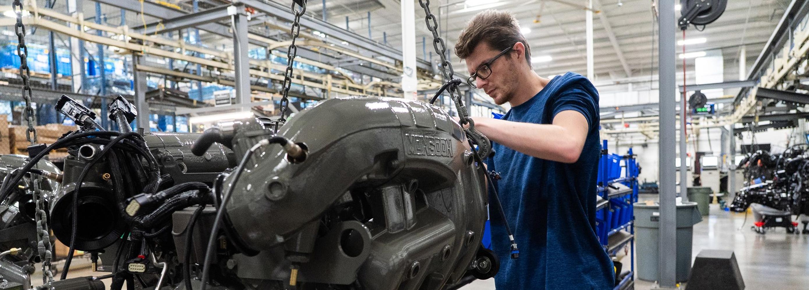 Marine Components Monsoon Engine on a hoist.