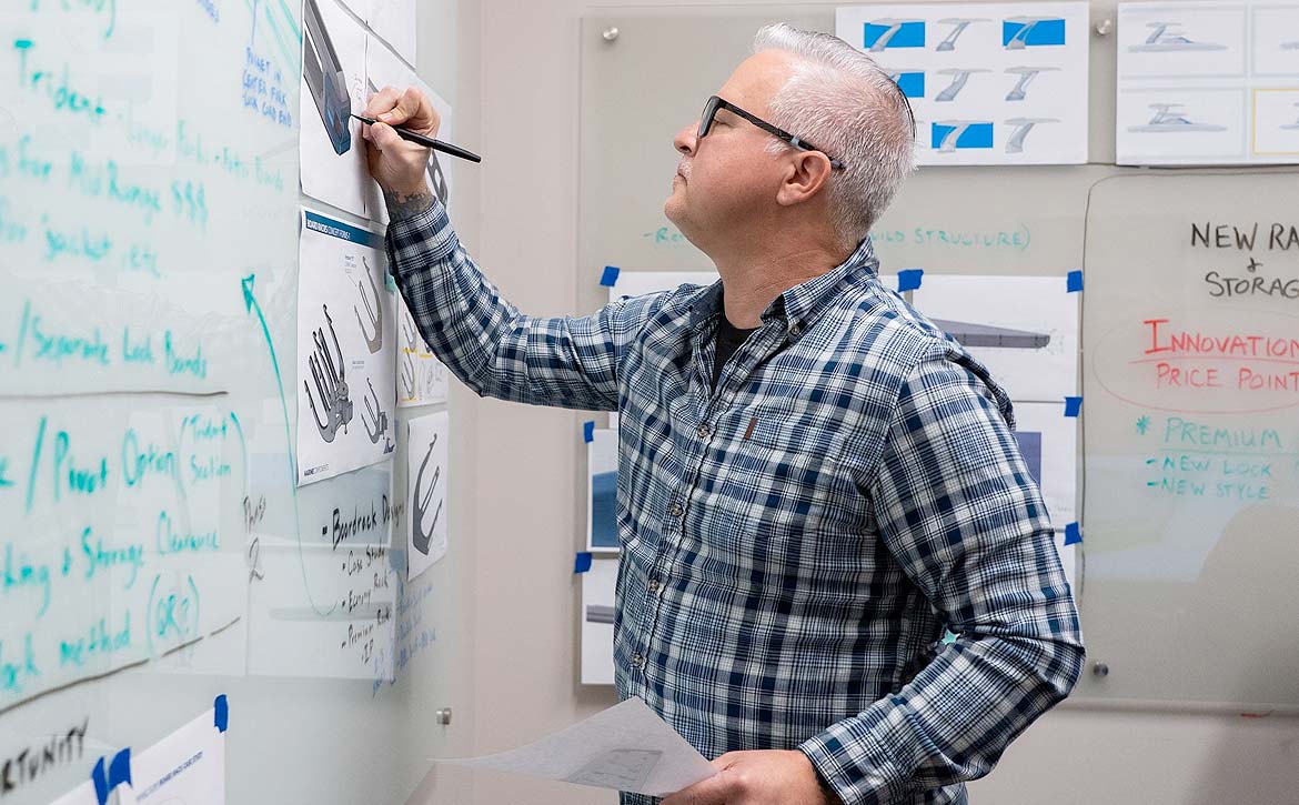 Engineer modeling a marine tower assembly.